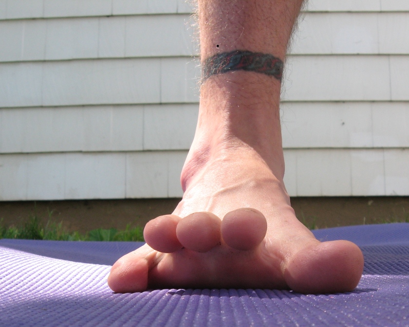 Yoga feet exercise, raising inner toes